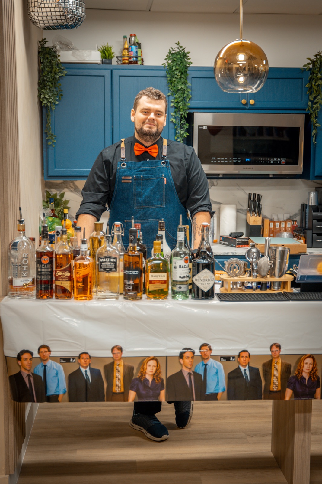 Dmytro mixing cocktails at a backyard house party in Miami