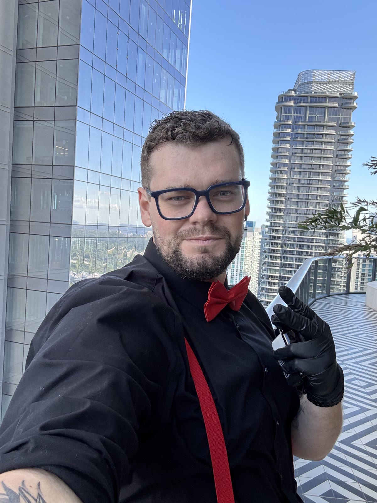 Bartender at Brickell rooftop with skyline view