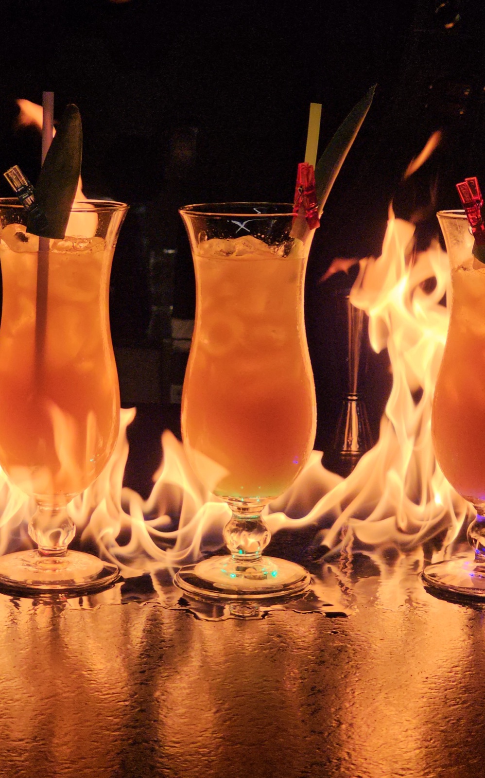 Flaming cocktails ignited during a fire show performance